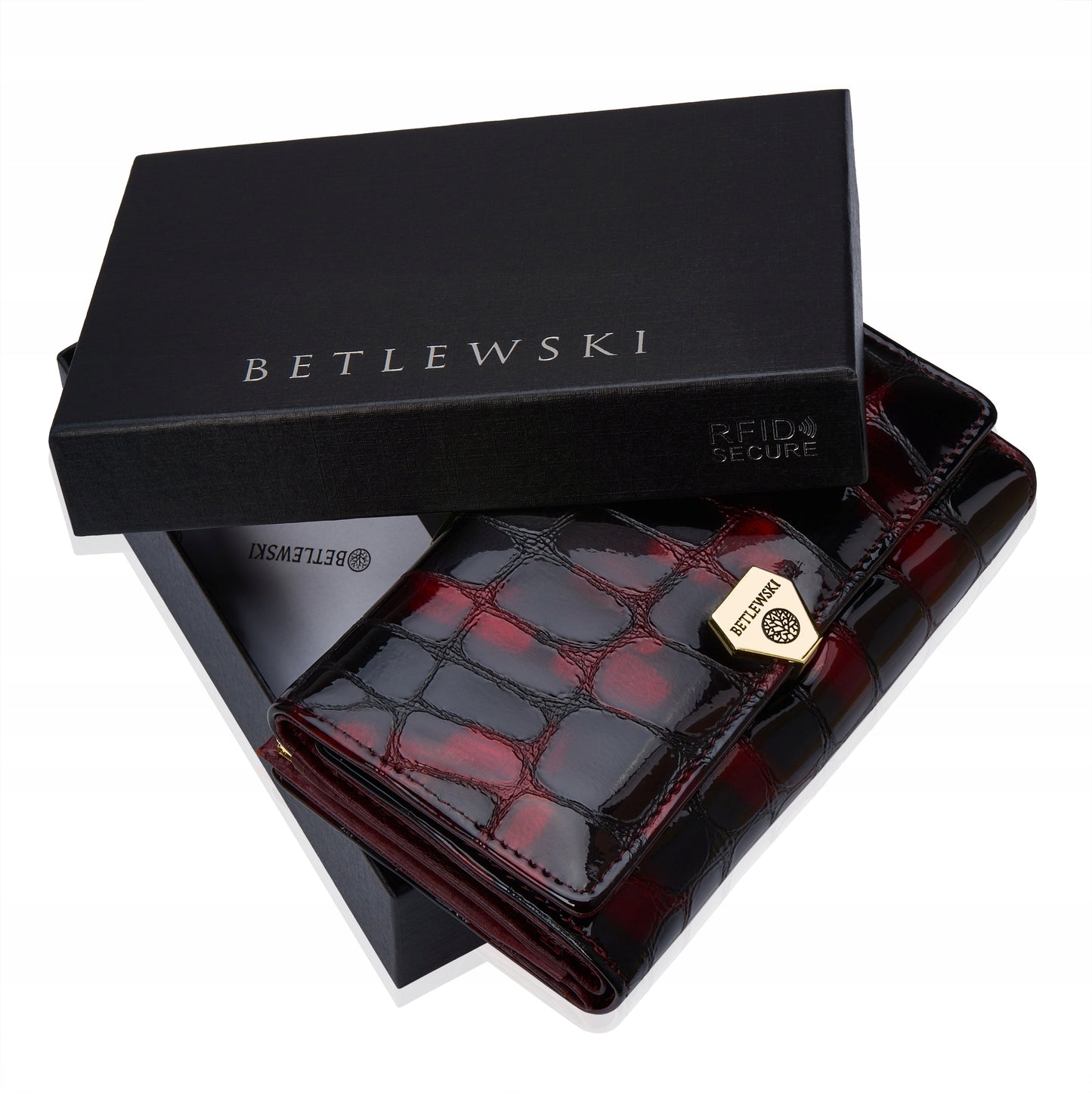 Stilinga lakuota odinė moteriška piniginė su monetų užsegimu Betlewski