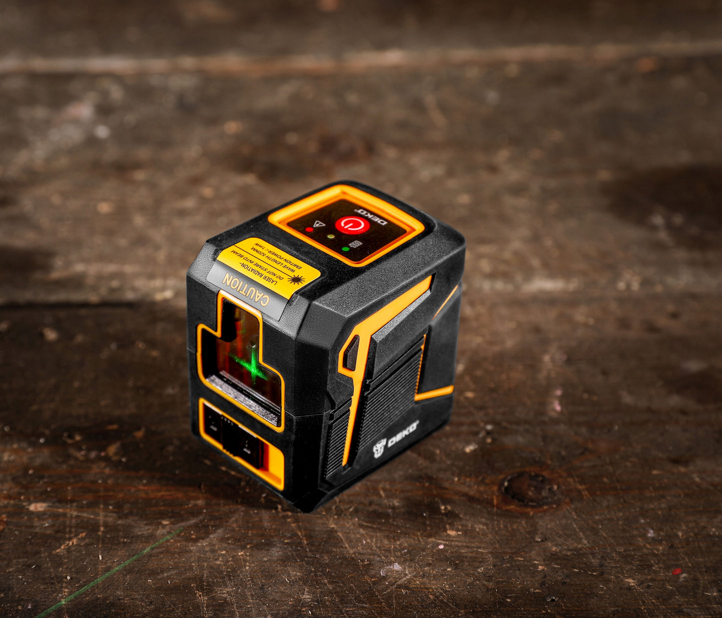 Tikslus žalias kryžminis lazerinis nivelyras su švytuoklės fiksatoriumi DEKO