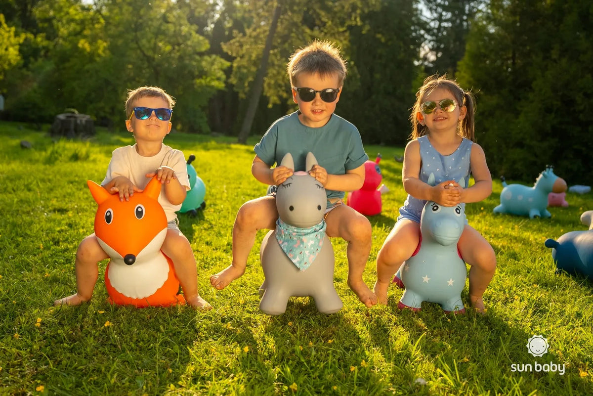 „Sun Baby“ mėlynas guminis žirafos formos šokliukas vaikams su pompa, nuo 12 mėn.